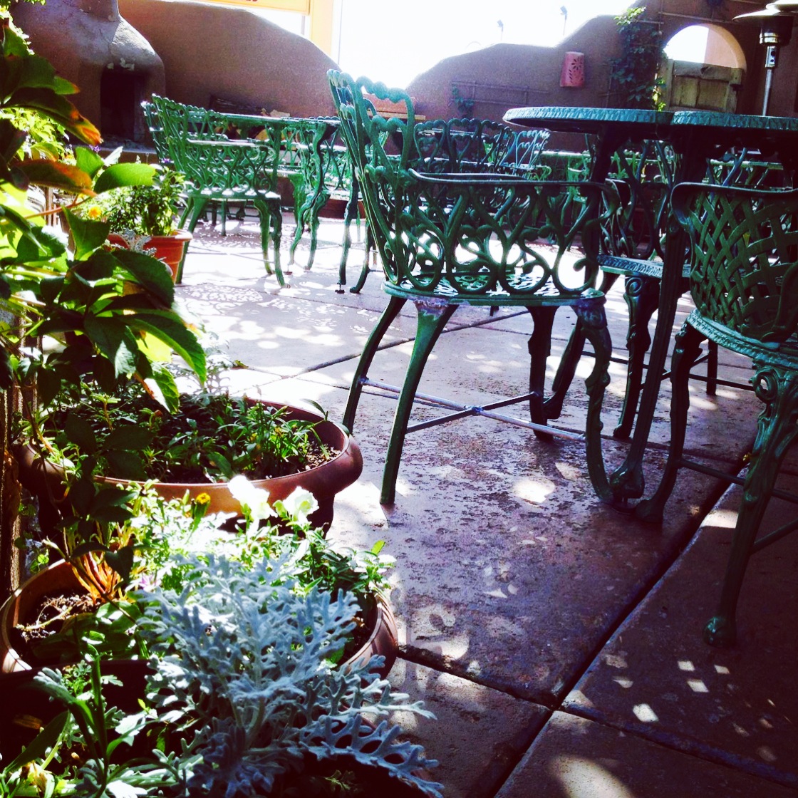 Clancy's outdoor patio with green iron furniture